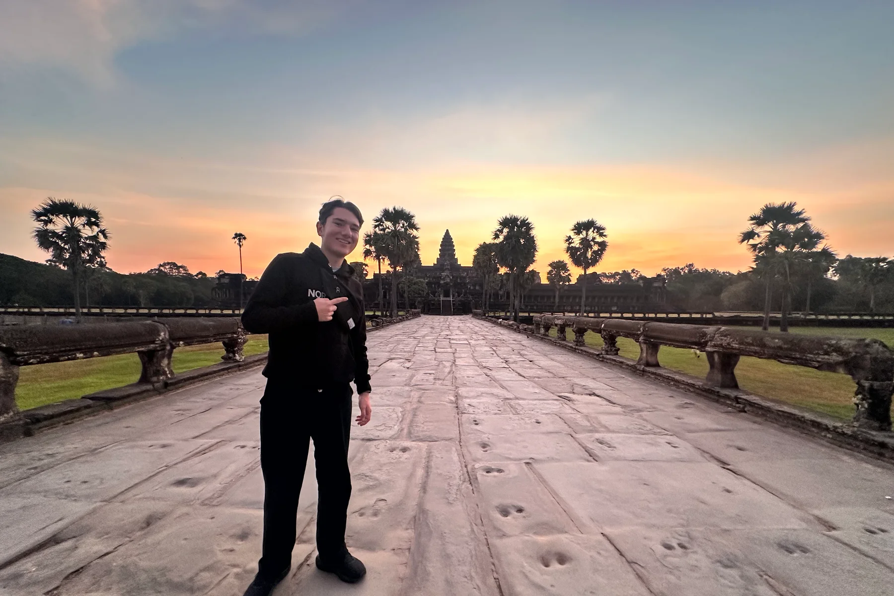 An Angkor temple at the second hour after sunrise — stone against humidity, no people in frame